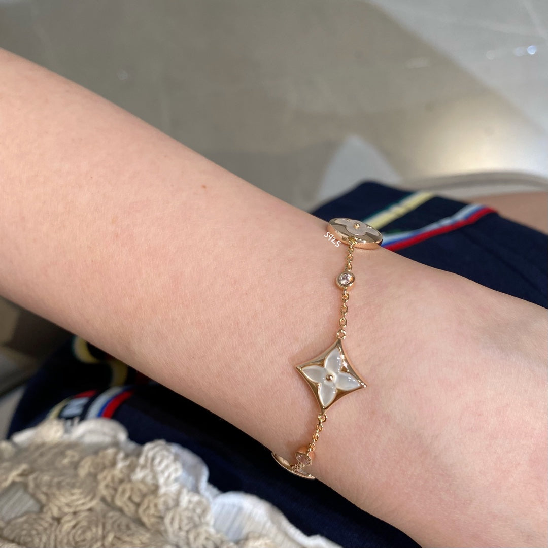 ¡®Loco¡¯STAR AND SUN 4 MOTIF WHITE MOP PINK GOLD BRACELET